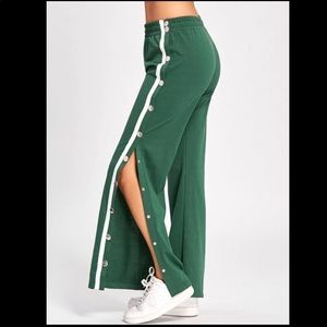 Green track pants.
